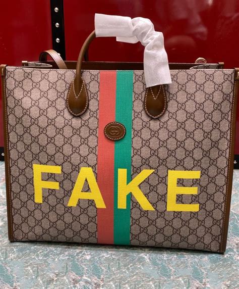 gucci bag with fake written on it|replica gucci bag.